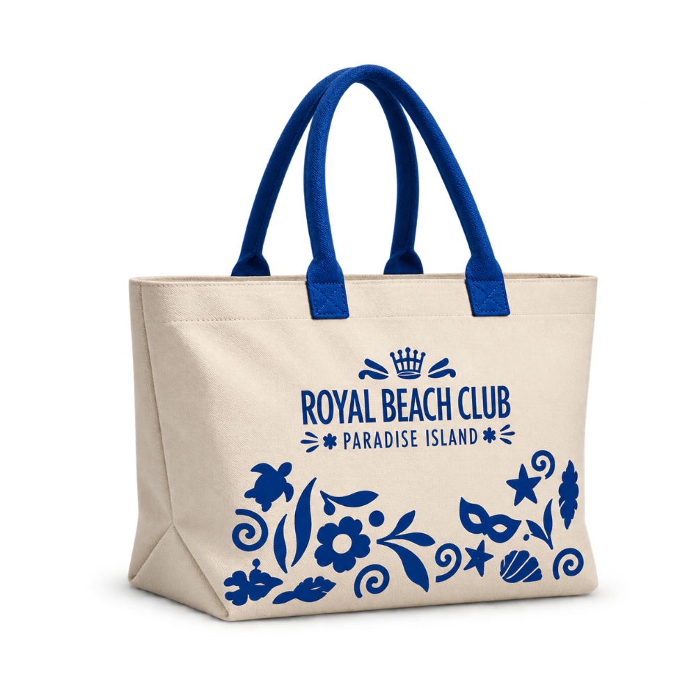 Bags Direct cream tote with royal blue handles, “Royal Beach Club Paradise Island” lettering and blue illustrations of a turtle, shells, starfish, flowers and tropical motifs.