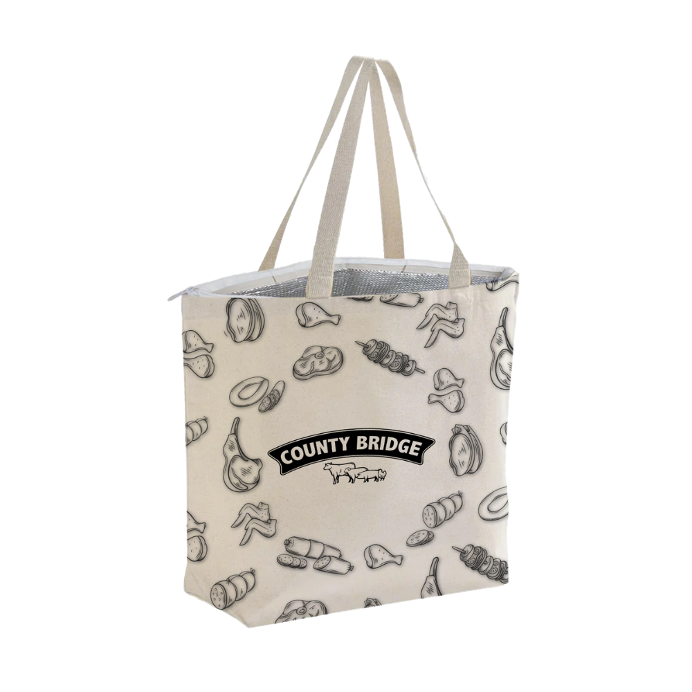 Bags Direct cream County Bridge cooler bag with long matching handles, a white zip closure, visible silver insulated lining and black line drawings of meat cuts, sausages and skewers around a centred logo.