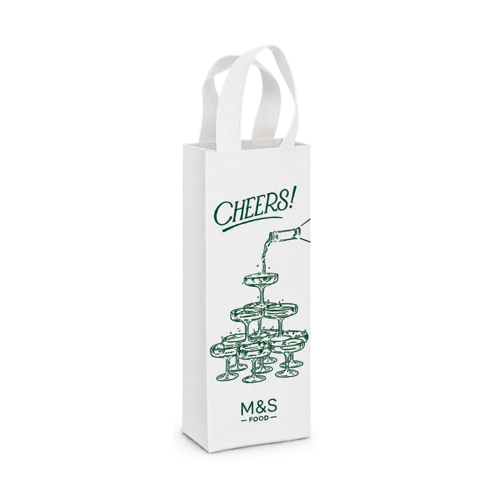 Bags Direct white single wine carrier with matching handles, dark green “Cheers!” lettering, an illustration of a bottle pouring into a champagne glass tower, and the M&S Food logo.